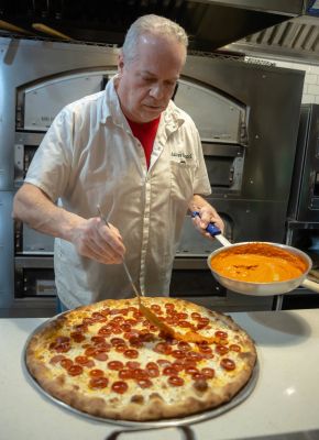 Andrew Belluccis pizzeria inside with Kanakis